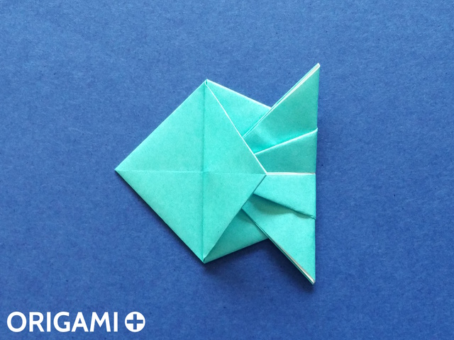 Оригами рибка-заверните левый клапан
